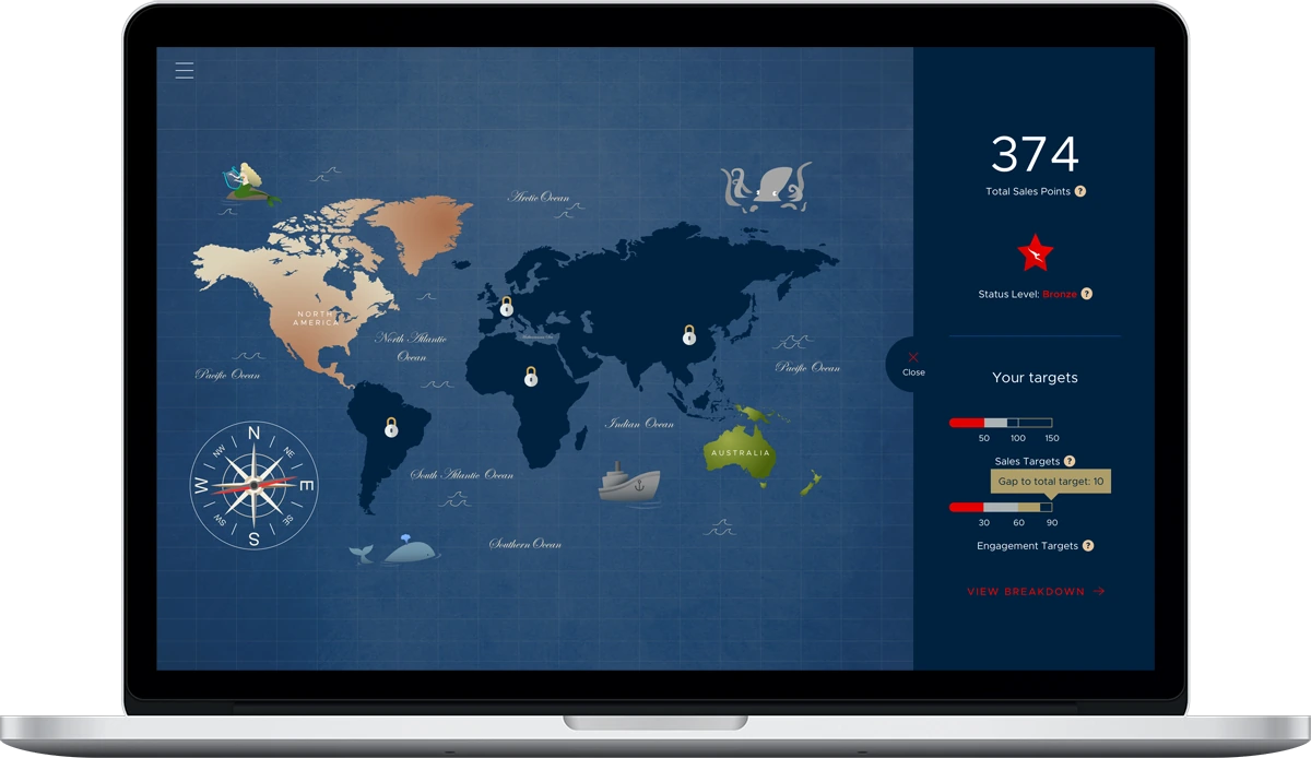 Qantas 100 campaign world map displayed on a MacBook