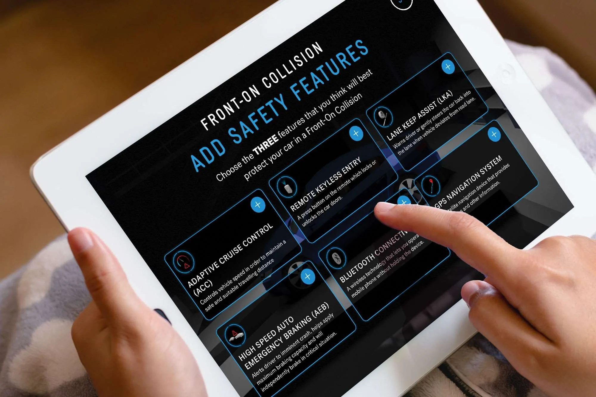 Crash Lab on an iPad, showing vehicle safety features available for a simulated collision.